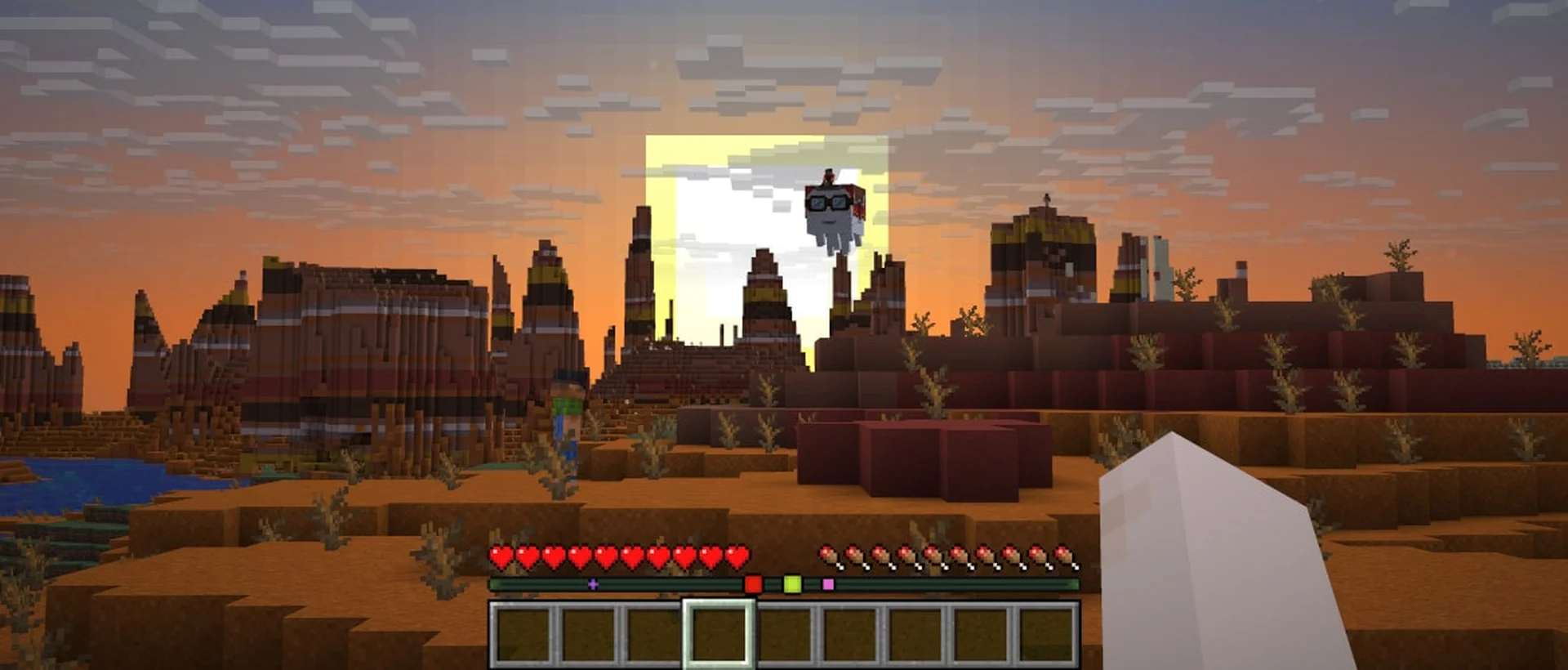 Players exploring a mountain landscape together in Minecraft